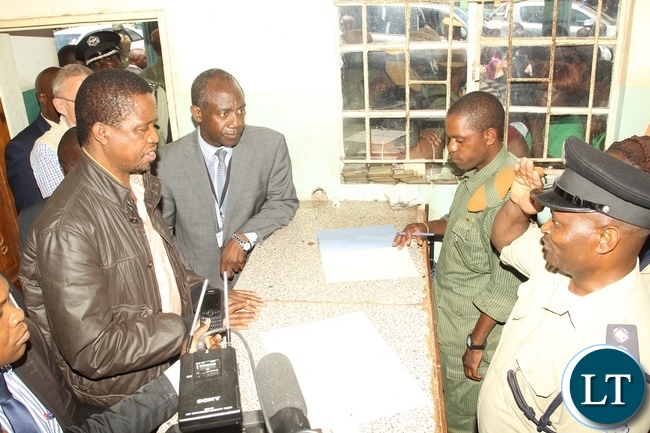 President Edgar Lungu being briefed by Officer in charge Repheal Moono on the 350 people who reported to the Police due to heavy rains in Baulini President Edgar Lungu being briefed by Officer in charge Repheal Moono on the 350 people who reported to the Police due to heavy rains in Baulini