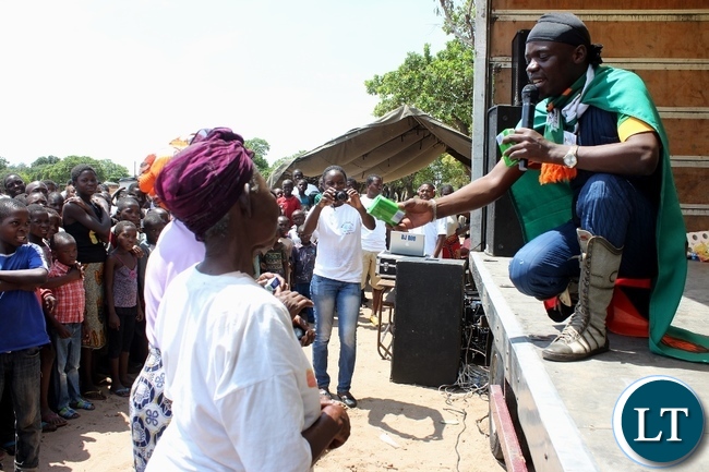 Mongu Mayor Bright Tombi (l) and his deputy Mather Mwenda (c) leaving a demo grass thatched toilet after inspecting it at Kalangu Primary School during the commemoration of World Toilet Day organized by Village Water Zambia in Mongu