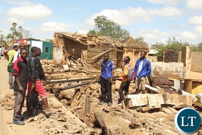 Baulini Resident looks helpless and in pain on the House destroyed due to heavy rains in Baulini