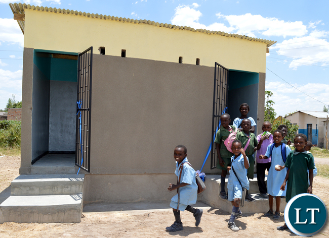 PUPILS at Kalundu Ka Maria Primary School in Choma in jubilation when District Commissioner Sheena Muleya with Choma New Apostolic Church apostle Becker Chakwana (not in picture) commissioned a newly built ablution block for the school