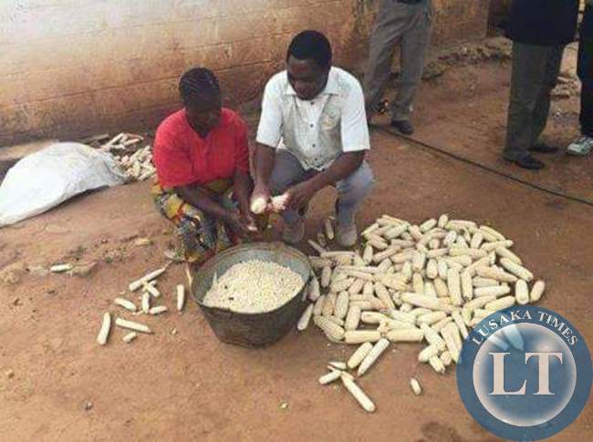 UPND president Hakainde Hichilema helping the women in Matero