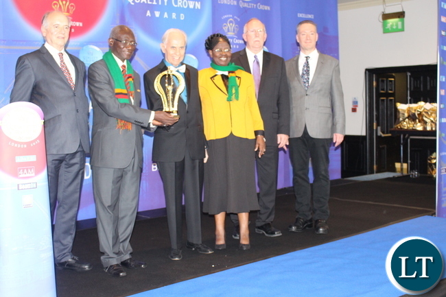 Immaculate college. Sanfroza and Simon Chomba receiving the award