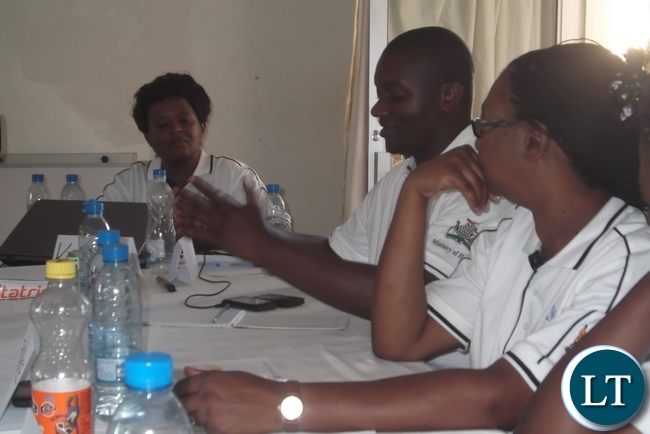 It is Government policy that men should be allowed to be with their wives during their wives delivery in the labour ward, where conditions are favourable for privacy and confidentiality, so that men should appreciate what their wives go through during labour which could help in increasing awareness on issues of integrated reproductive health practices which includes effective family planning among couples. Here Mansa Provincial Health Office Disease Control Specialist Dr. Victor Chalwe is sharing his personal experience of how he sat through the labour process when his wife delivered their first child. Listening with keen interest is UNFPA Programme Coordinator for Luapula Province Florence Mulenga (in glasses) and Provincial Medical Health Office Principal Nursing Officer Mrs.Tembo Kasengele.