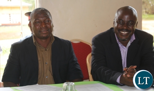 Mbala District Commissioner, Kedrick Sikombe (l) with District Adminstrative Officer, Felix Mungaila watching drama during the celebrations of 16 Days of Activism