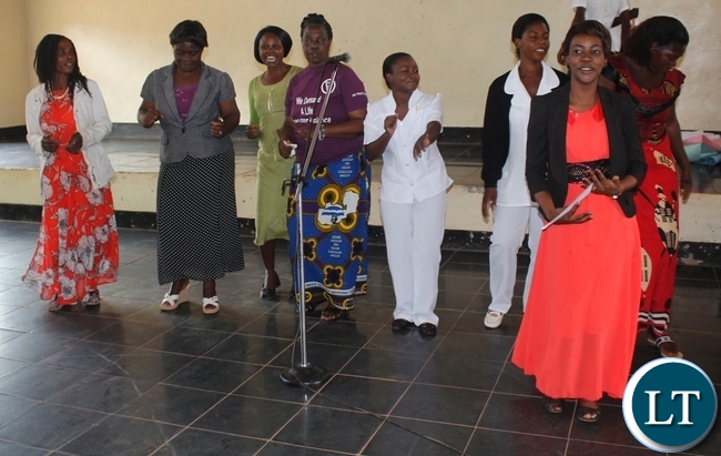 Mbala Women Area Association chairperson, Albertina Kapumfi,(m) with other women dancing during the celebrations of 16 Days of Activism at Grasshopper