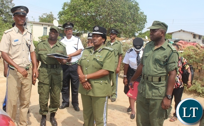 Inspector General of Police Stella Libongani (middle) with her Officers checking on the condition of Police houses during her tour of the Police camps in Kabwe Inspector General of Police Stella Libongani (middle) with her Officers checking on the condition of Police houses during her tour of the Police camps in Kabwe
