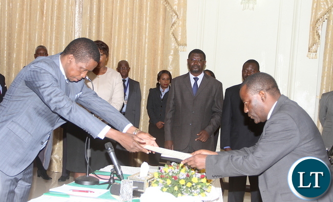 President Lungu receives an affidavit of Oath from newly appointed Commerce deputy minister Raymond Mpundu during the swearing-in-ceremony at State House on Tuesday, November 10,2015 -Picture by THOMAS NSAMA President Lungu receives an affidavit of Oath from newly appointed Commerce deputy minister Raymond Mpundu during the swearing-in-ceremony at State House on Tuesday, November 10,2015 -Picture by THOMAS NSAMA
