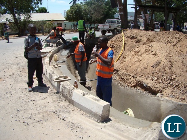 SOME of the roads in Choma district, which is now Southern province Headquarter, have been upgraded to bituminous standard. On the picture the contractor is now working on the drainage system before the onset of the rains.