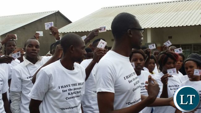 Some Kabushi youths elated youths showing off their newly acquired NRC's and Voters cards