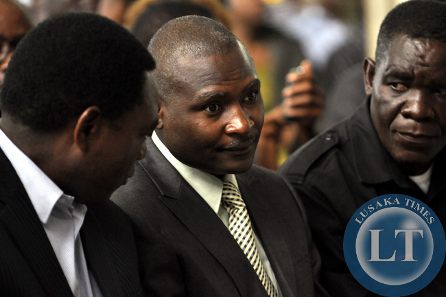 UPND president Hakainde Hichilema confers with Alliance for Better Zambia leader Father Frank Bwalya