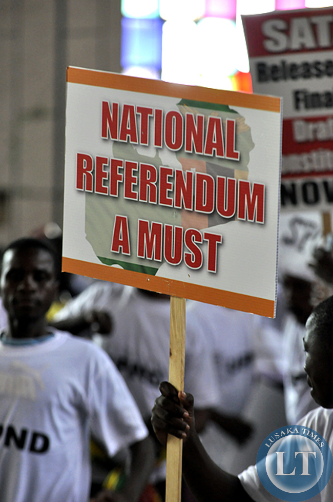 FILE: UPND youths carry a placard to demand for the referendum as the mode of adopting the controversial draft constitution