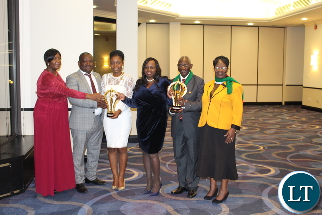 in a long dress, 1st secrretary Trade Irene Chengo, the Kauti's, in blue dress deputy high commissioner patricia Sikaala chanda and the Chomba's