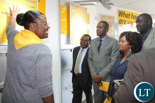 MTN Zambia Service Centre Senior Manager Maureen Chishimba explains service centre operations to members of the Parliamentary Committee on Transport, Works, Supply and Communications (l-r: Mwansa Kapeya, Ephraim Belemu, Anne Chungu and Request Muntanga) during the committee's familiarisation tour of MTN Zambia in Lusaka.