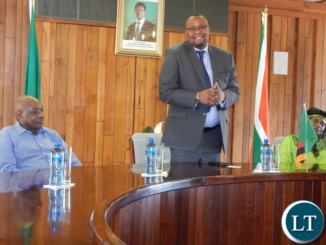 Zambia's High Commissioner to South Africa His Excellency Mr. Emmanuel Mwamba, speaks while Dr. Vernon Mwaanga and Ms. Chilufya Kapwepwe listen in