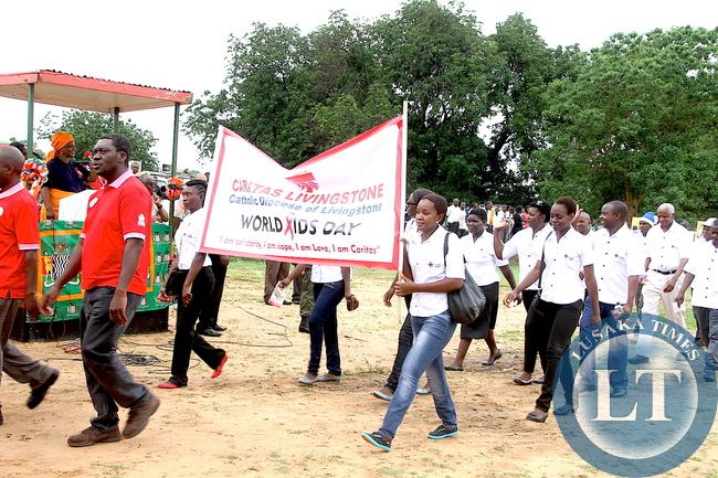 Caritas Livingstone march past First Lady Esther Lungu during the World AIDS day Commemoration march past in Livingstone on Monday, December 1,2015 -Picture by THOMAS NSAMA