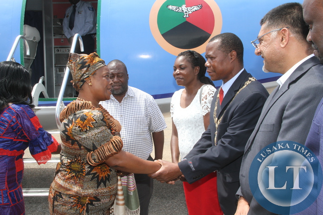 First Lady Esther Lungu being welcomed by Chingola mayor Titus Tembo on arrival at Kasompe Air stripe on Monday, December 7,2015 to check and witness various projects that are being undertaken by various stakeholders and those that are undertaken by Konkola Copper mine (KCM) under Cooperate Social responsibility -Picture by THOMAS NSAMA