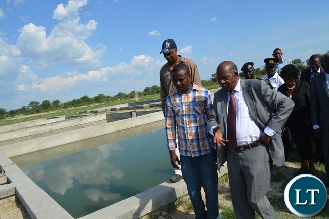 Finance Minister Alexander Chikwanda at Inyambo Community Development Trust where he gave them a loan of K3, 3 million to boost fish production Finance Minister Alexander Chikwanda at Inyambo Community Development Trust where he gave them a loan of K3, 3 million to boost fish production