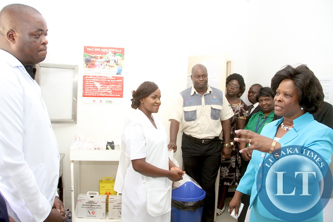 First Lady Esther Lungu with State House clinic's Dr Webster Chishimba and nurse-in-charge Prudence Mwanaumo during a tour of State House Clinic on Thursday, December 10,2015 -Picture by THOMAS NSAMA
