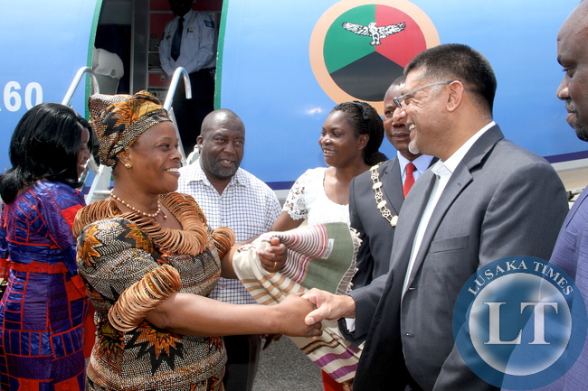 First Lady Esther Lungu being welcomed by Steven Din, KCM Chief Executive Officer on arrival at Kasompe Air stripe on Monday, December 7,2015 to check and witness various projects that are being undertaken by various stakeholders and those that are undertaken by Konkola Copper Mine (KCM) under Corporate Social responsibility -Picture by THOMAS NSAMA