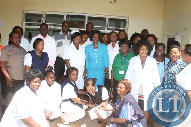 First Lady Esther Lungu with State House clinic staff after a tour of State House Clinic on Thursday, December 10,2015 -Picture by THOMAS NSAMA