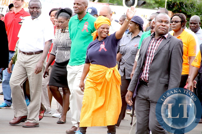 First Lady Esther Lungu with Southern Province minister Nathaniel Mubukwanu during the World AIDS day Commemoration march past in Livingstone on Monday, December 1,2015 -Picture by THOMAS NSAMA