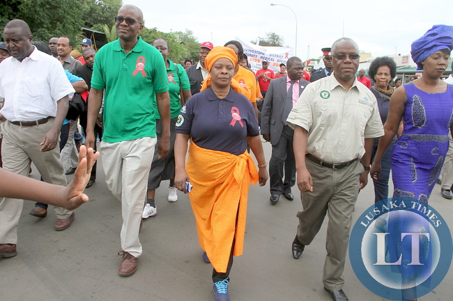 First Lady Esther Lungu with Southern Province minister Nathaniel Mubukwanu during the World AIDS day Commemoration march past in Livingstone on Monday, December 1,2015 -Picture by THOMAS NSAMA