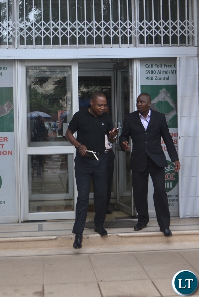 Kalusha Bwalya with ACC investigating officer Emmanuel Mwenge