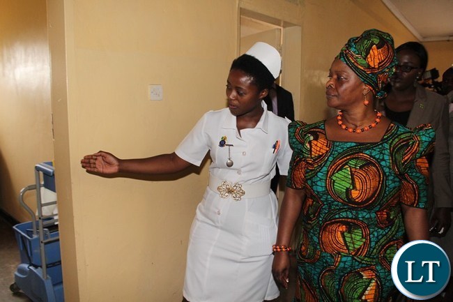 FIRST Lady Esther Lungu talks to Nurse In-Charge Wrayrose Lombe at Mahatma Gandhi clinic. This was when the first Lady toured the health institution Livingstone FIRST Lady Esther Lungu talks to Nurse In-Charge Wrayrose Lombe at Mahatma Gandhi clinic. This was when the first Lady toured the health institution Livingstone