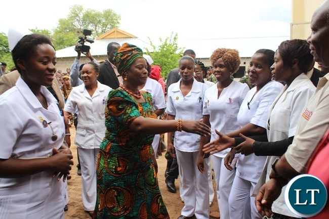 FIRST Lady Esther Lungu (2nd left) greets Linda clinic staff while Nurse In-Charge Memory Hamaleka (left) does the introductions at Linda clinic in Livingstone
