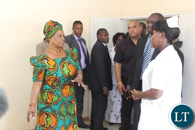 FIRST Lady Esther Lungu (2nd left) greets Linda clinic staff while Nurse In-Charge Memory Hamaleka (left) does the introductions at Linda clinic in Livingstone