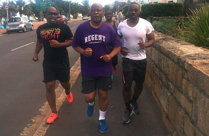 Nevers Mumba jogging in the street of Cape Town South Africa. According to him, "Best exercise to expel teargas from the chest!"