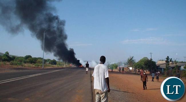 Some tenants riots against their eviction on Contract Haulage houses in Chipata yesterday.The tenants burnt tyres and block the Great East road.Pictures By VINCENT SOKO