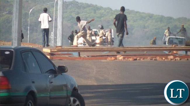 Some tenants riots against their eviction on Contract Haulage houses in Chipata yesterday.The tenants burnt tyres and block the Great East road.Pictures By VINCENT SOKO