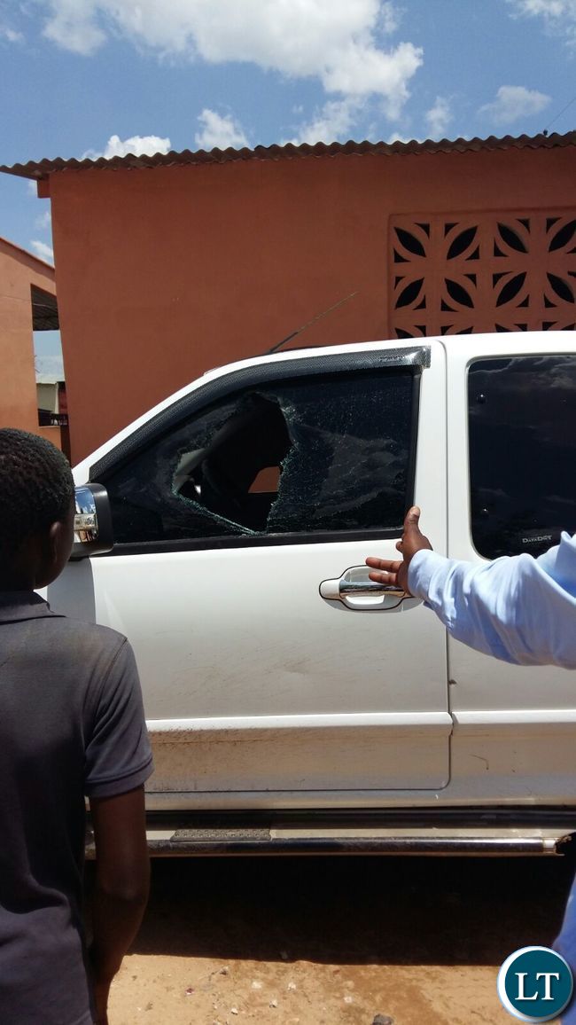 Smashed windows of one of the vehicles belonging to the FDD