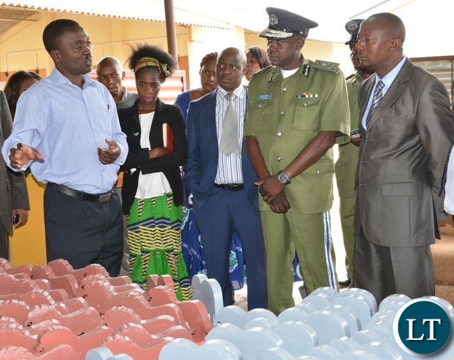 The head of department of construction at Lusaka Youth Center Mr. Kaimana Charles shows part of the work to the Acting Permanent Secretary Ministry of Youth Sport and child Development Mr. Alfonso Banda (r) next the deputy inspector general of police Mr. Engine Sibote (c) during the graduation ceremony for the Lusaka youth resource center The head of department of construction at Lusaka Youth Center Mr. Kaimana Charles shows part of the work to the Acting Permanent Secretary Ministry of Youth Sport and child Development Mr. Alfonso Banda (r) next the deputy inspector general of police Mr. Engine Sibote (c) during the graduation ceremony for the Lusaka youth resource center