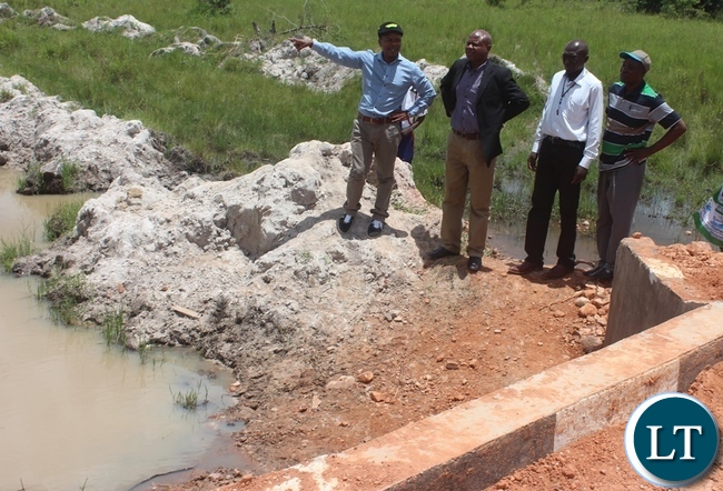 Government through Disaster Management and Mitigation Unit (DMMU) has constructed a Bridge in Kabwe's Kalwelwe area in the out-skirts of Kabwe. In the Picture, Area MP Sydney Mushanga (left) with his entourage checking on the Bridge Government through Disaster Management and Mitigation Unit (DMMU) has constructed a Bridge in Kabwe's Kalwelwe area in the out-skirts of Kabwe. In the Picture, Area MP Sydney Mushanga (left) with his entourage checking on the Bridge