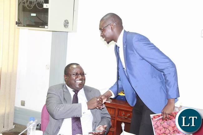Eneya Phiri from CSO-SUN shakes hands with Katuba MP Jonas Shakafuswa after making his submission
