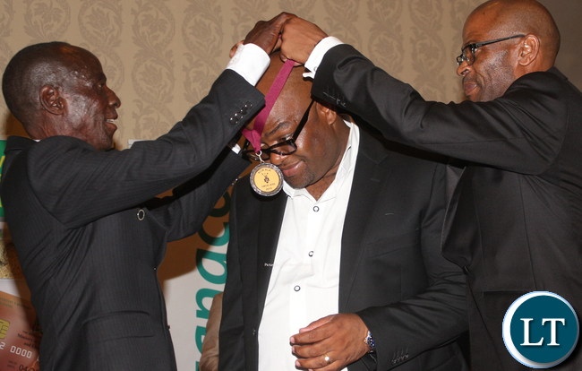 Amon Jere being awarded for serving as Chairman of N"cwala Cermony chariman 2006- 2008 during the time he initiated the construction of a modern laweni (residence of Inkosi yama Nkosi during the N'cwala Ceremony) among others.
