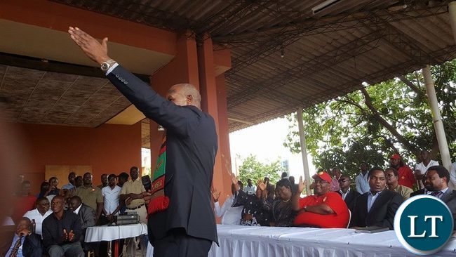 Lupando Mwape shows the UPND symbol