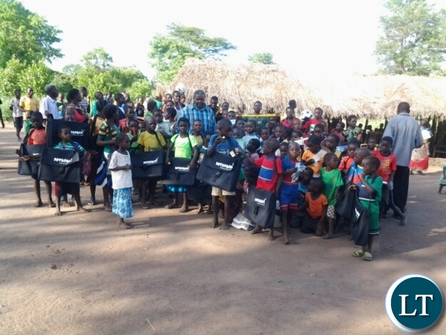 Malambo Patriotic Front Member of Parliament Jacob Shuma with Chitilila community school pupils in Mambwe.The grass thatched community school is serving a number of pupils who had not enrolled due to distances to the nearest schools. Malambo Patriotic Front Member of Parliament Jacob Shuma with Chitilila community school pupils in Mambwe.The grass thatched community school is serving a number of pupils who had not enrolled due to distances to the nearest schools.
