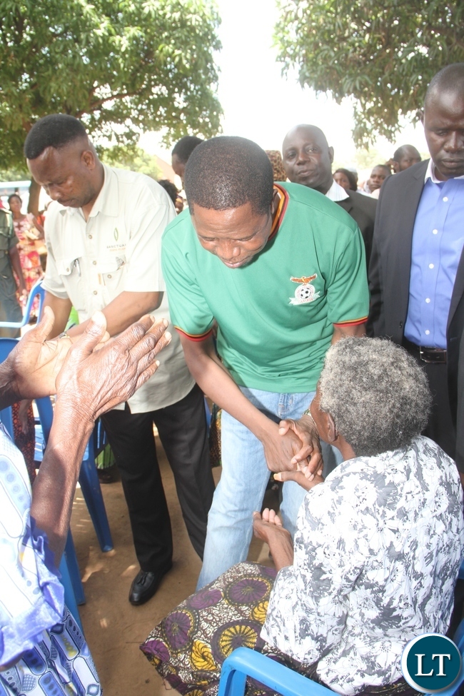 President Lungu presents New Year gifts to the Aged in Lusaka's Matero Township on January 1,2015 -Picture by THOMAS NSAMA