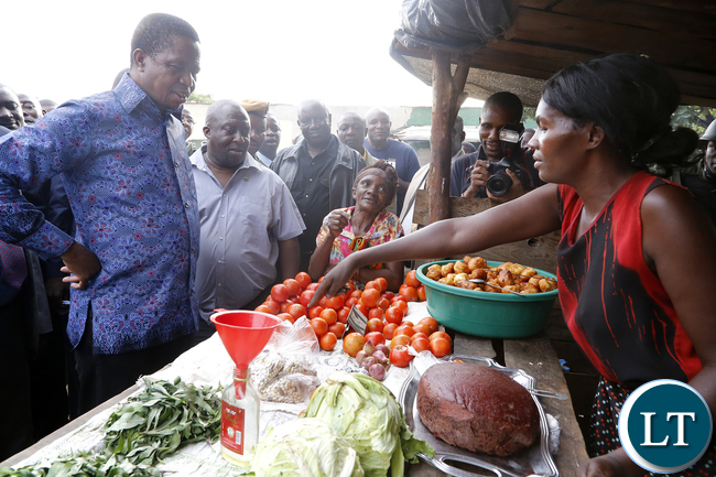 President Edgar Chagwa Lungu buys Tradition vegetables at Baluba Road Side Market on Ndola - Kitwe Due High Waythe First Family stopped over to Meet Traders and Exchanges Views 16-01-2016, PICTURE BY EDDIE MWANALEZA/STATEHOUSE
