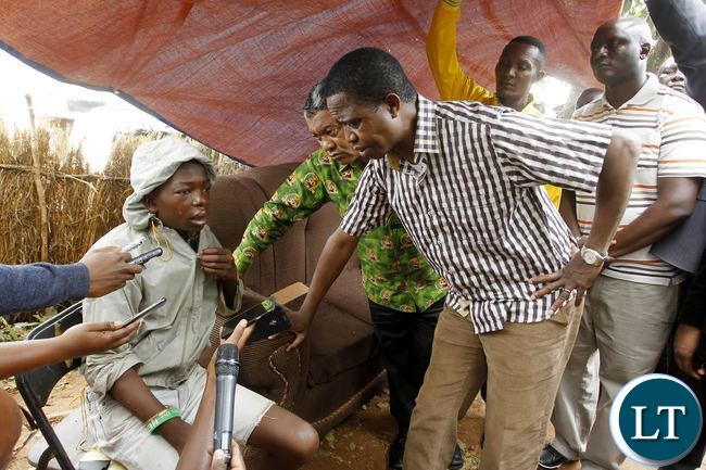 President Edgar Chagwa Lungu (right) talks to one of the survivors of the Hail Storm in Lusaka's Chilenje on Saturday,January 9,2015. PICTURE BY SALIM HENRY/STATE HOUSE ©2016