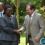 Clerk of the National Assembly Doris Mwinga(l) chats with the Airtel Managing Director Peter Coreia(r) after the signing of  the memorandum of understanding at Pamodzi hotel