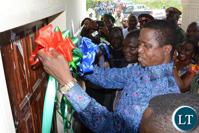 President Lungu and Southern Province Minister Nathaniel Mubukwanu show party symbol on his arrival at Namwala ground