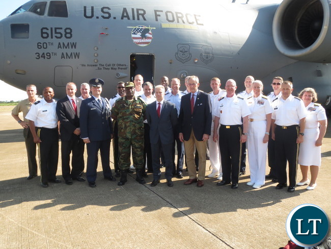 Ambassador Schultz and Zambian military officials greet U.S. military visitors.