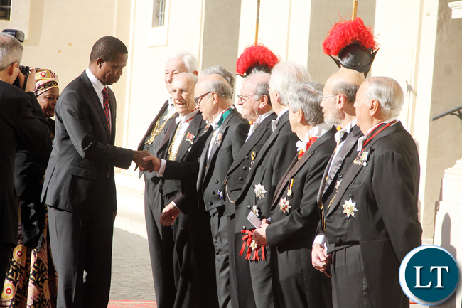 President Lungu greets Vatican staff on arrival at Vatican where he met the Pope on Feb 5,2016 -Picture by THOMAS NSAMA