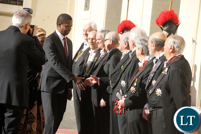 President Lungu greets Vatican staff on arrival at Vatican where he met the Pope on Feb 5,2016 -Picture by THOMAS NSAMA