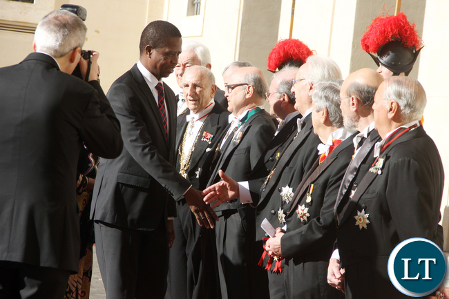 President Lungu greets Vatican staff on arrival at Vatican where he met the Pope on Feb 5,2016 -Picture by THOMAS NSAMA