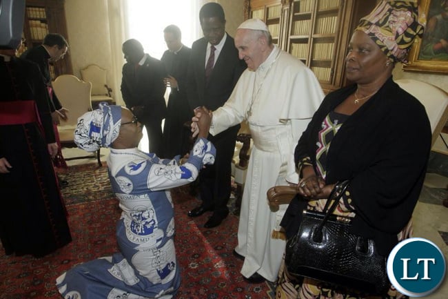 Mumbi Phiri shaking hands with Pope Francis